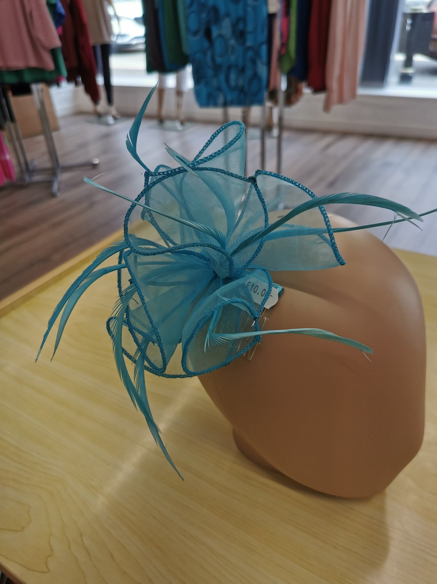 flower comb fascinator with feathers.