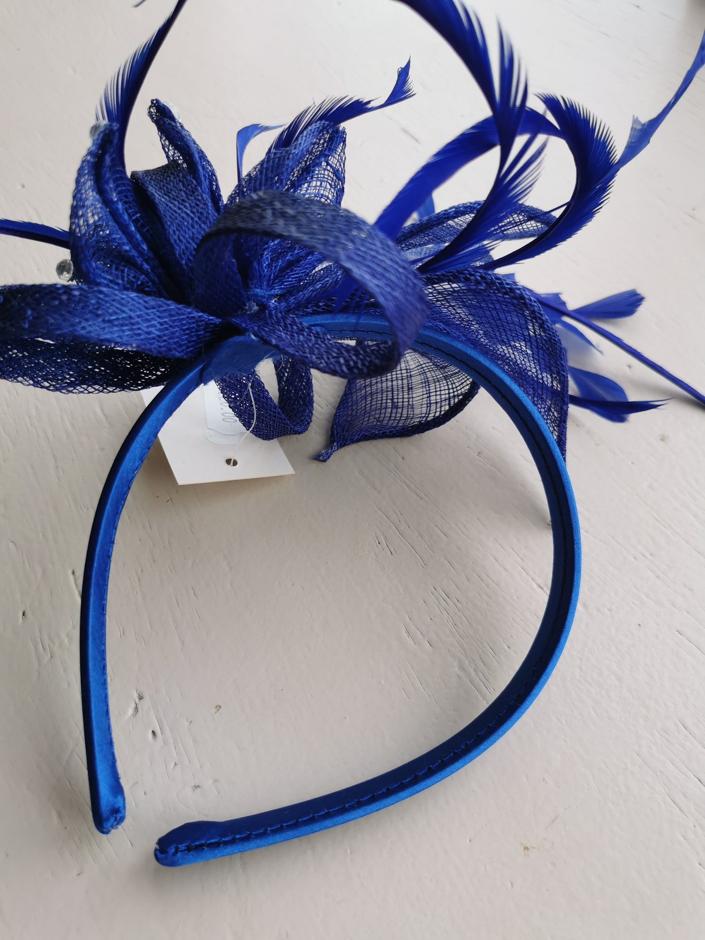 Flower Fascinator on a Satin Alice band with feathers and Clear acrylic stones