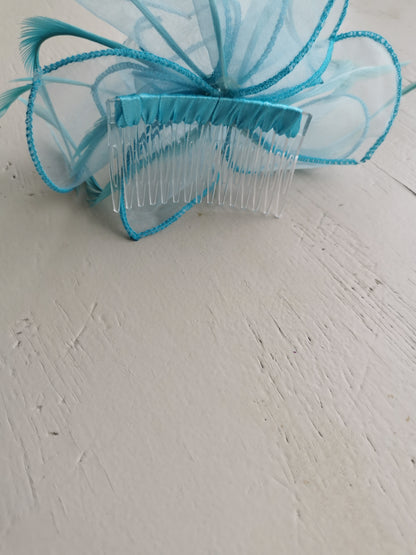 flower comb fascinator with feathers.