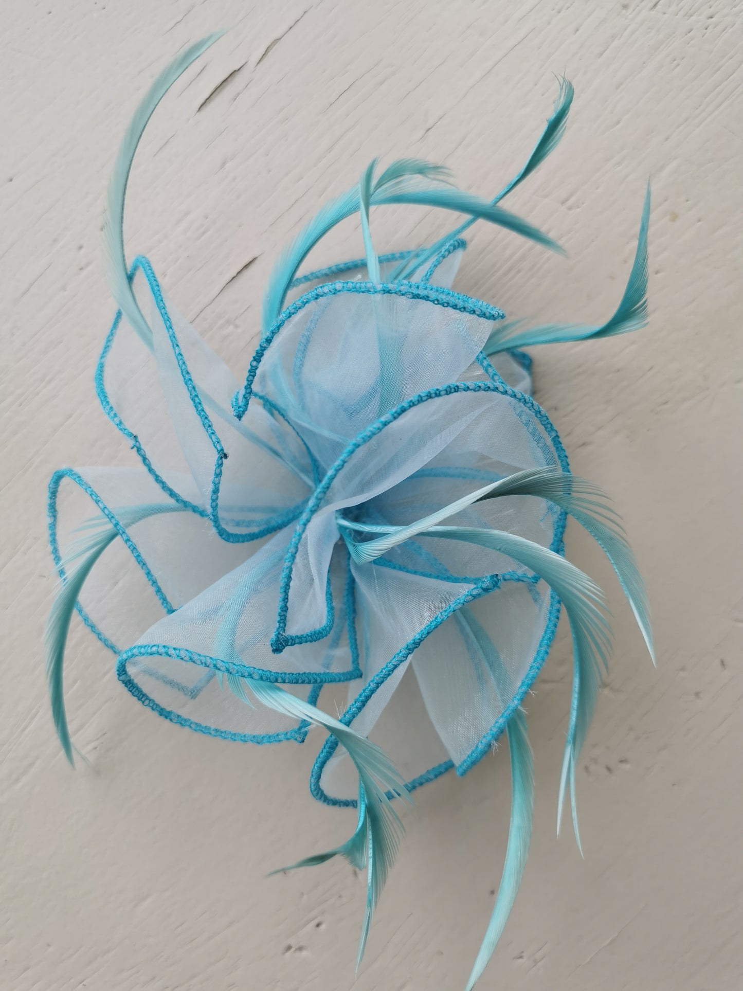 flower comb fascinator with feathers.