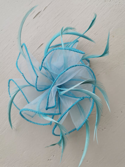 flower comb fascinator with feathers.
